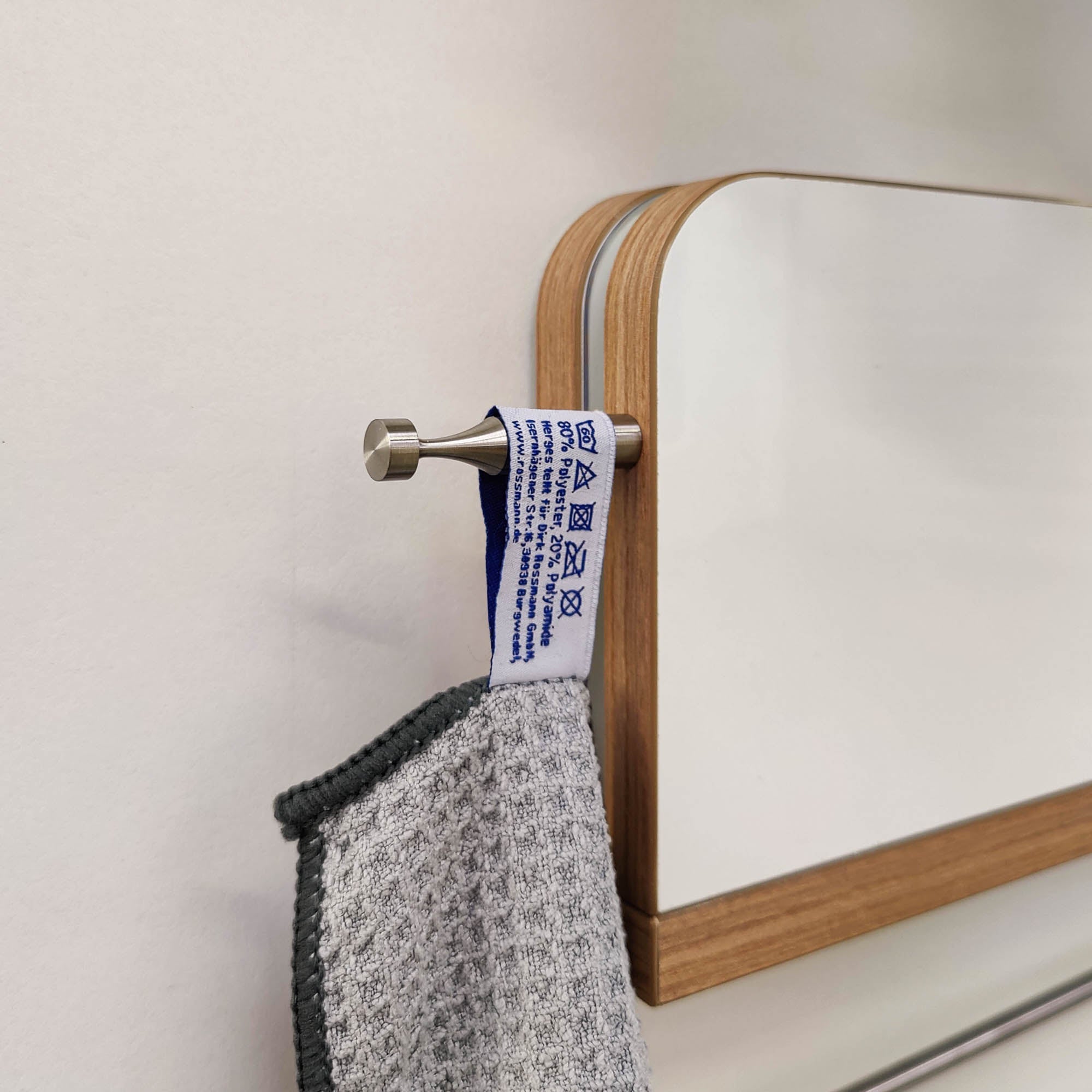 Hooks for hinged shelf